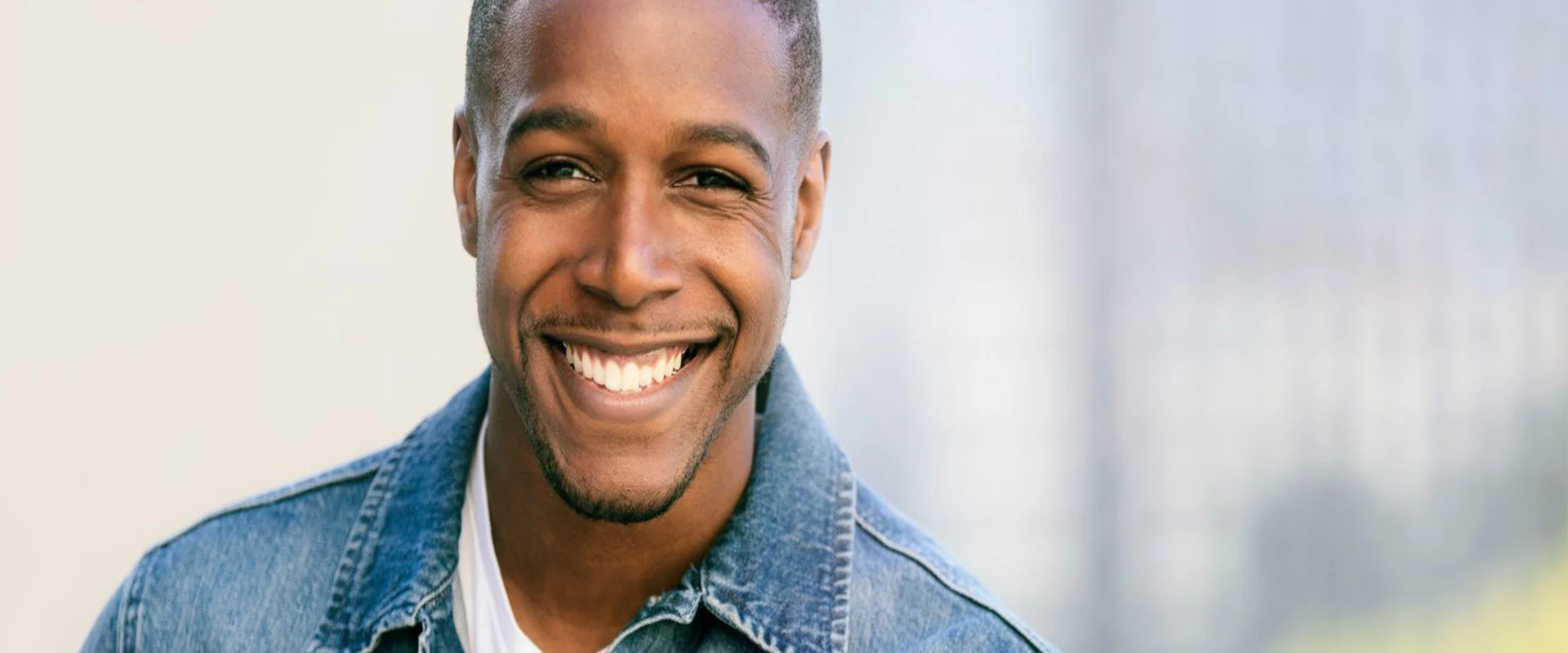 Patient holding an Invisalign clear aligner tray