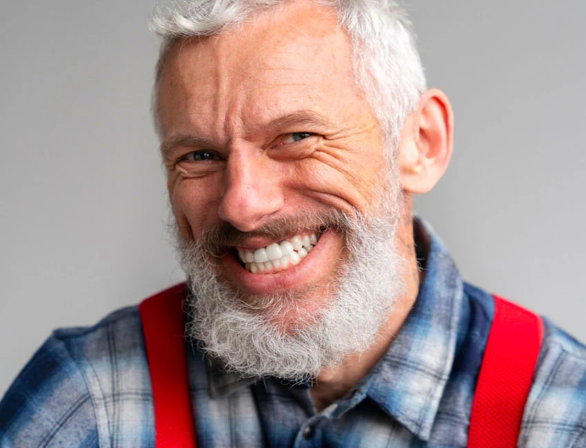 Patient smiling confidently after dental implant treatment in Etobicoke
